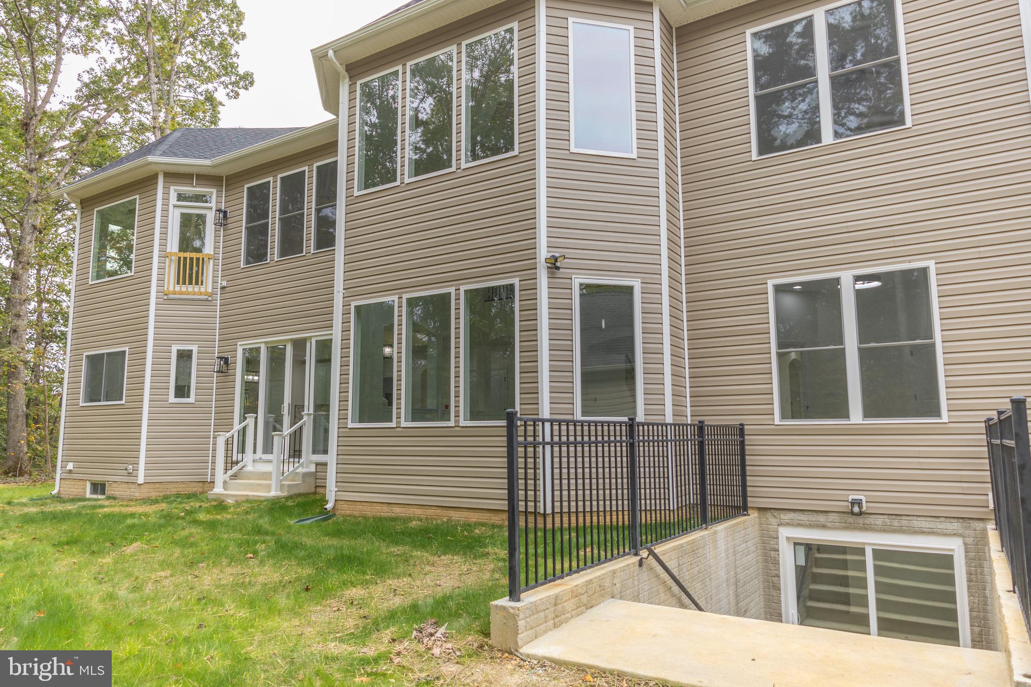 10401 Laurel Ridge Way Fredericksburg, VA 22408 - Photo 47 of 49 a view of a house with a yard
