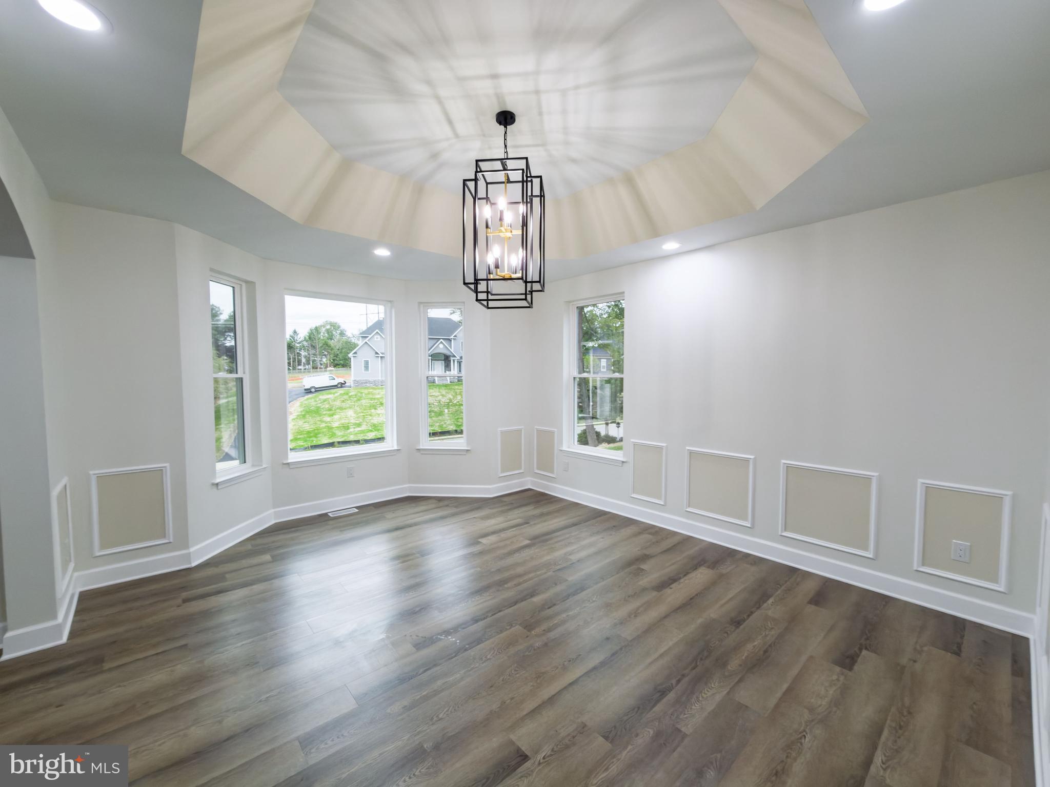 10401 Laurel Ridge Way Fredericksburg, VA 22408 - Photo 10 of 49 an empty room with wooden floor chandelier and windows