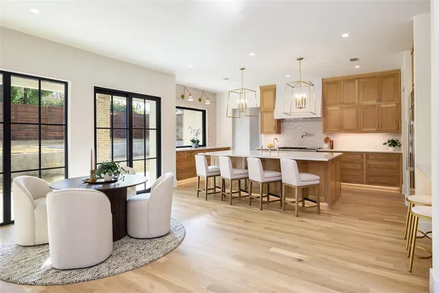 a living room with kitchen island furniture and a large window