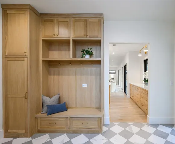 a living room with furniture and a painting on the wall