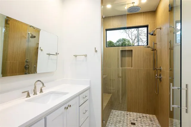 a bathroom with a sink and a mirror