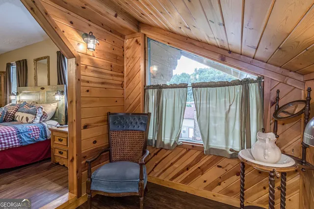 a bed room with a bed and a chair