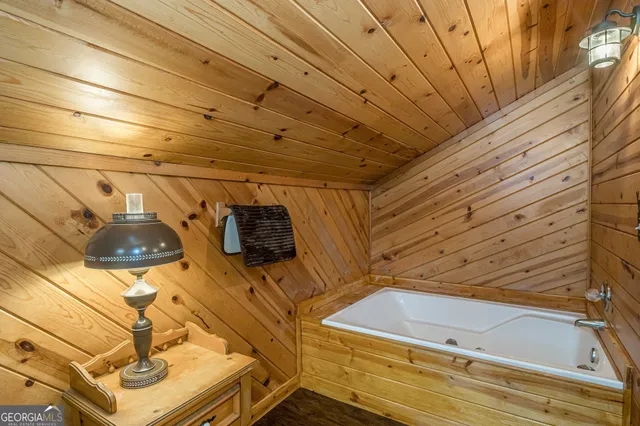 a bathroom with a bathtub and shower