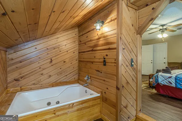a bathroom with a tub and shower