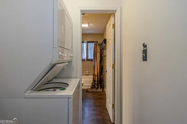 a view of storage and utility room with wooden floor