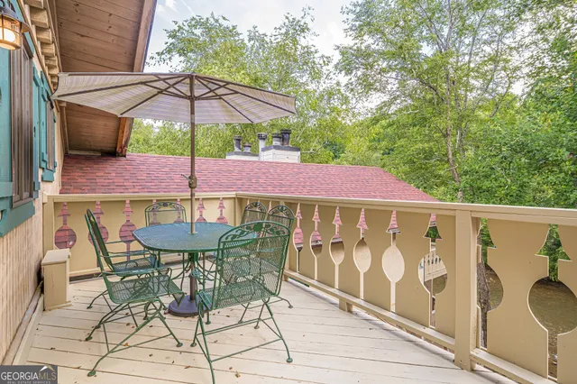 a patio with a patio table and chairs