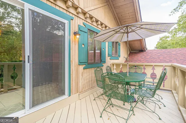 a patio with a yard table and chairs