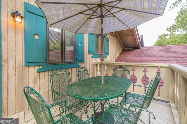 a view of a table and chairs in the patio