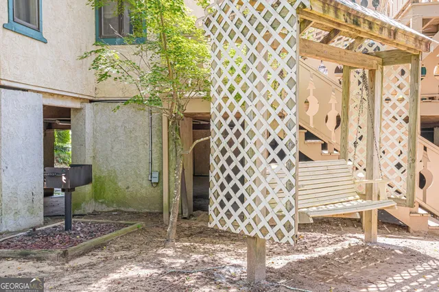 a view of a brick house with a large windows