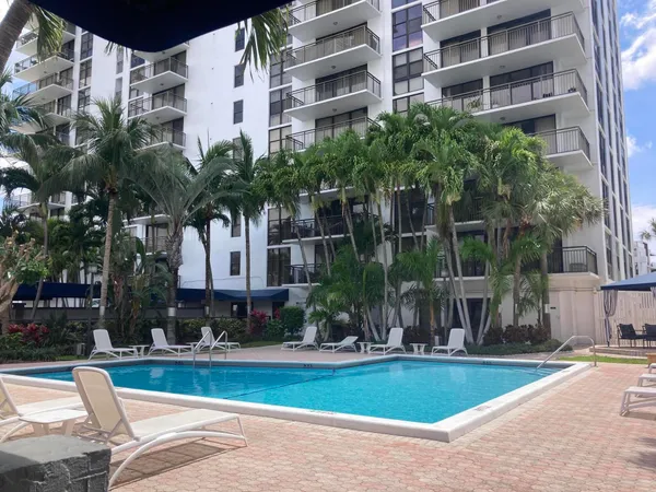 a front view of building with yard