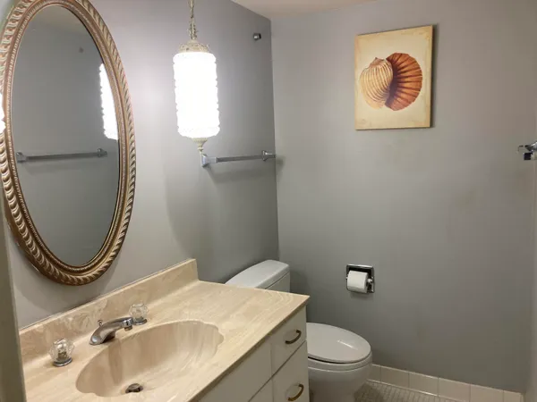 a bathroom with a toilet and a sink