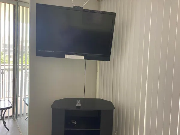 a bathroom with a shower and a sink