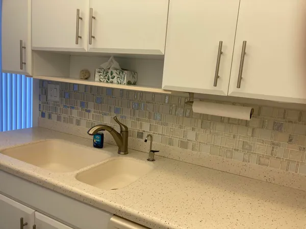 a bathroom with a sink and a window