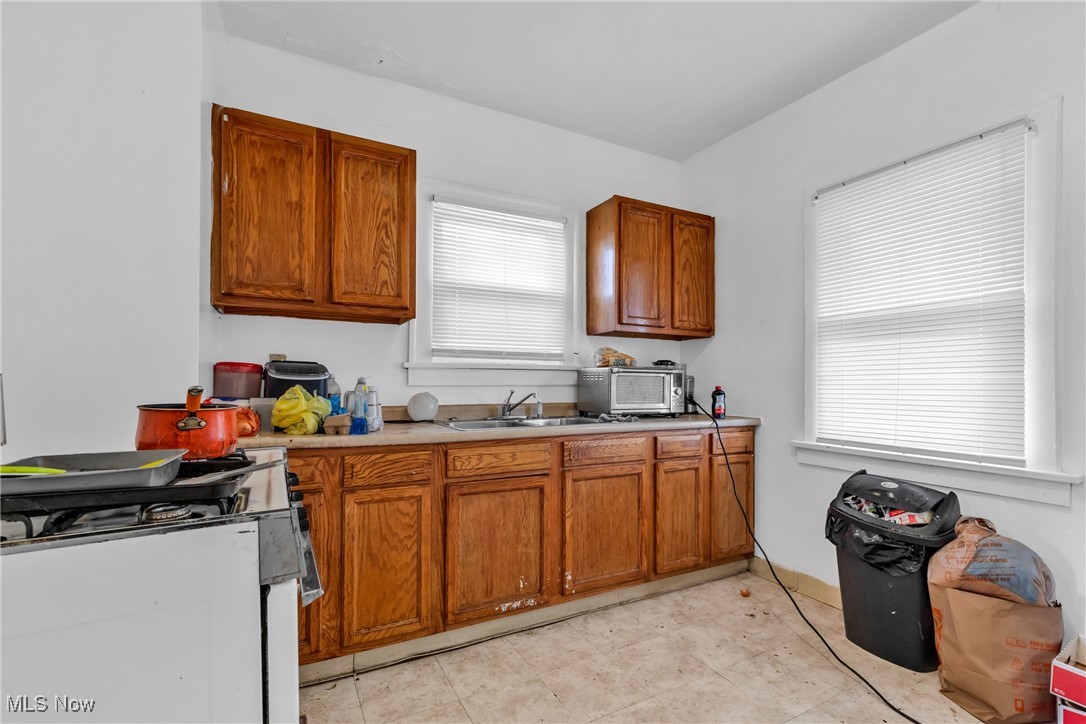 3770 Mayfield Road Cleveland Heights, OH 44121 - Photo 6 of 22 Kitchen featuring sink, a wealth of natural light, and gas range gas stove