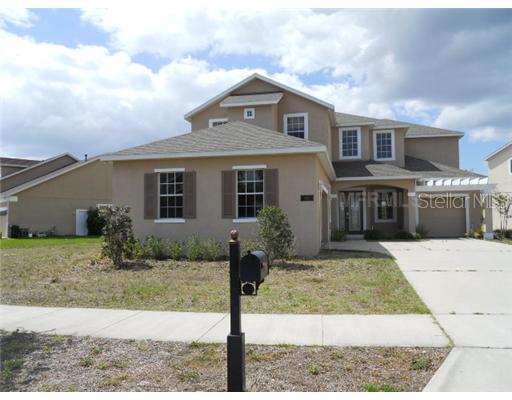 4527 Indian Deer Road Windermere, FL 34786 - Photo 1 of 1 a front view of a house with garden