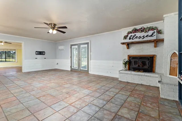 a view of an empty room with a fireplace