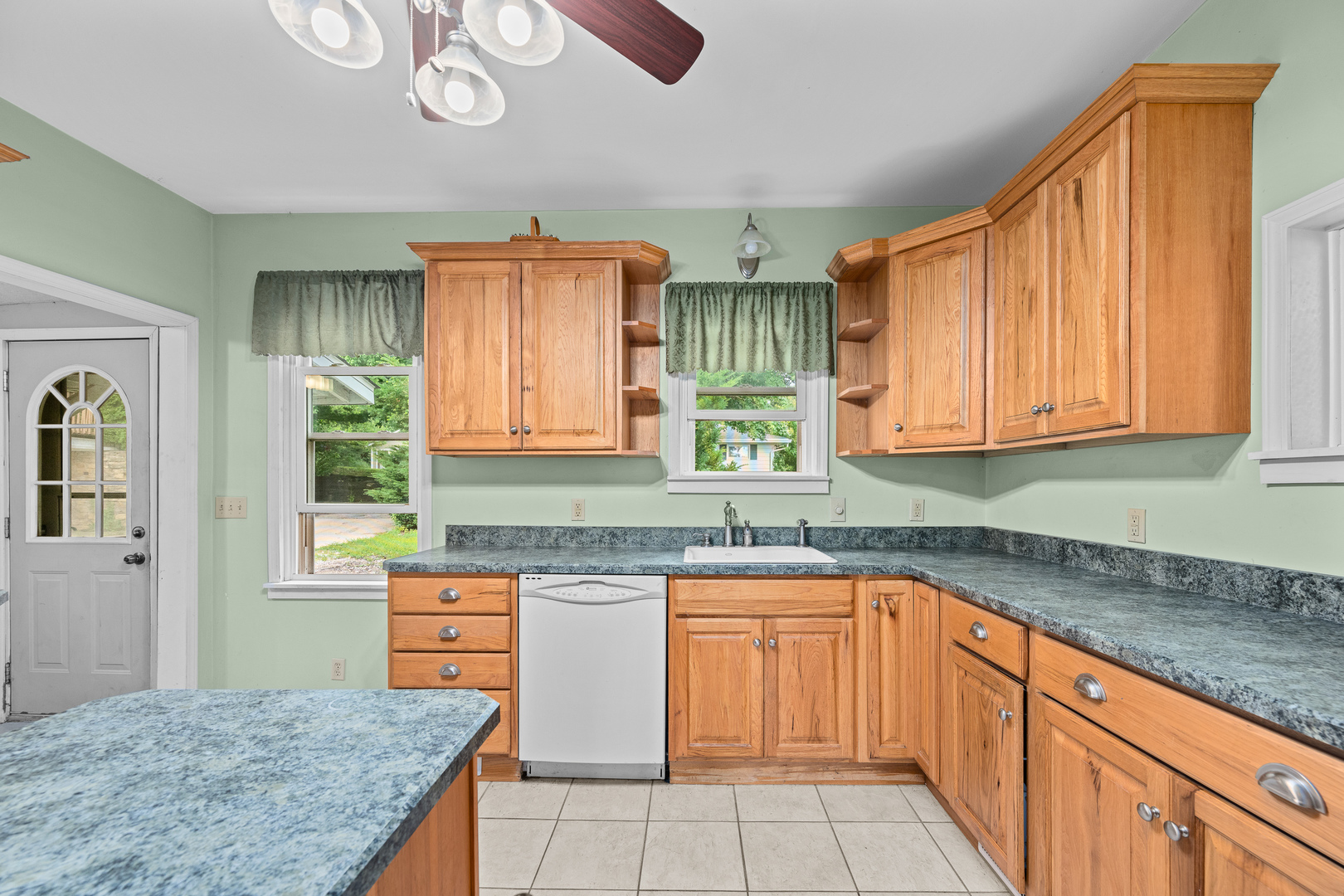 802 North High Street Port Byron, IL 61275 - Photo 22 of 43 a kitchen with stainless steel appliances granite countertop a sink and cabinets