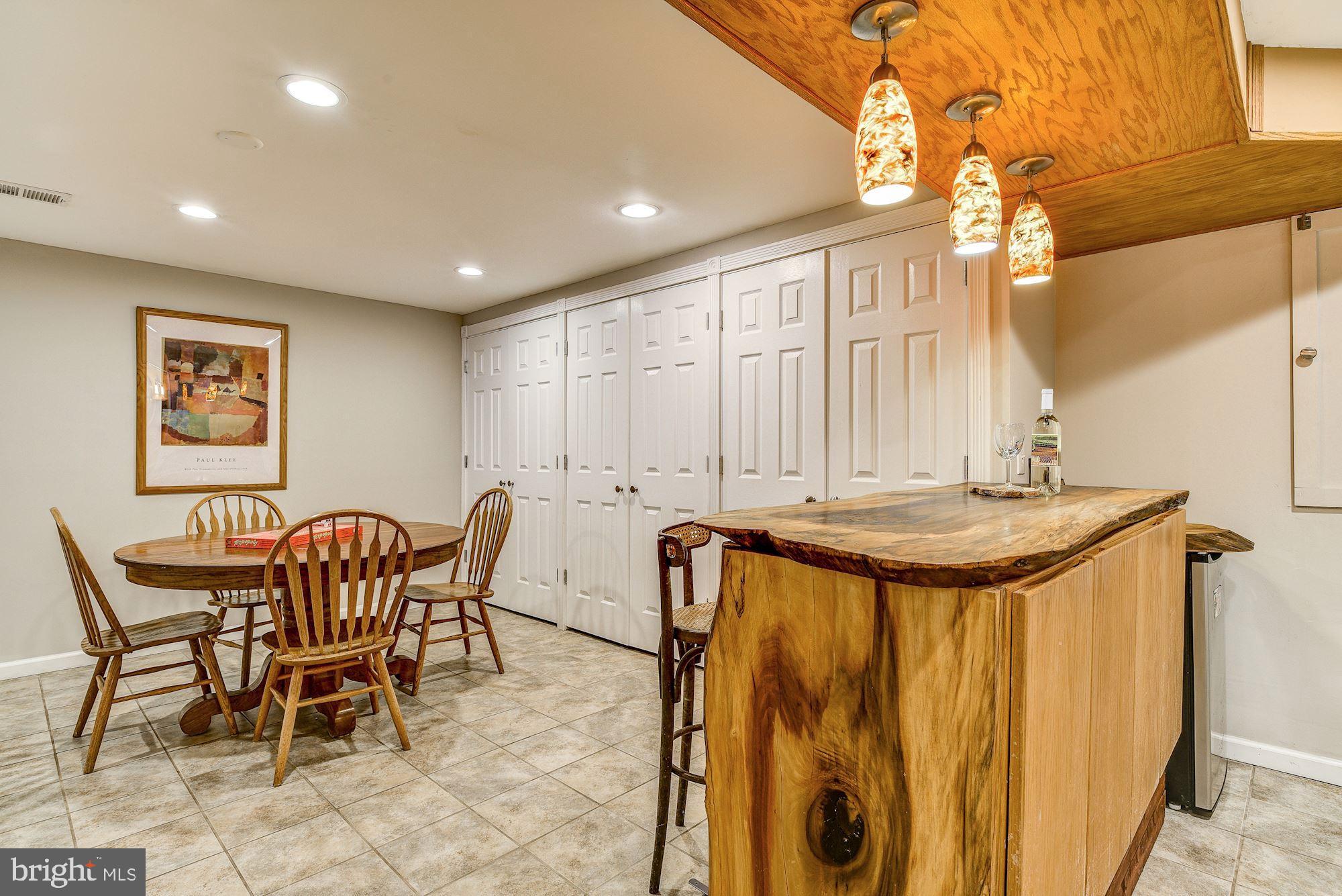 11912 Hall Shop Road Clarksville, MD 21029 - Photo 35 of 50 Lower Level Live-Edge Wet Bar and Feature Pendants