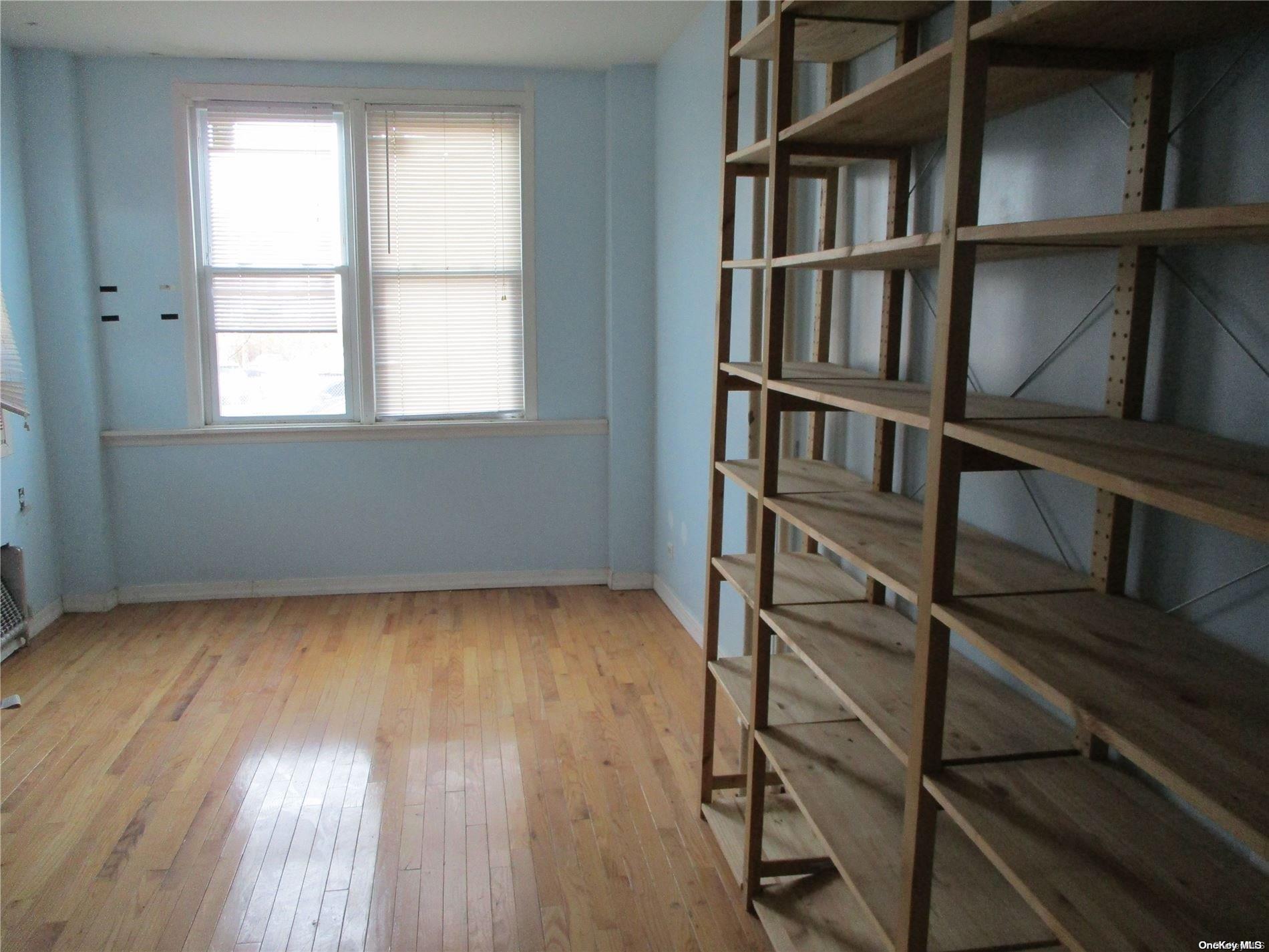 135 Beach 124th Street Queens, NY 11694 - Photo 13 of 25 a view of a room with cabinet and a window