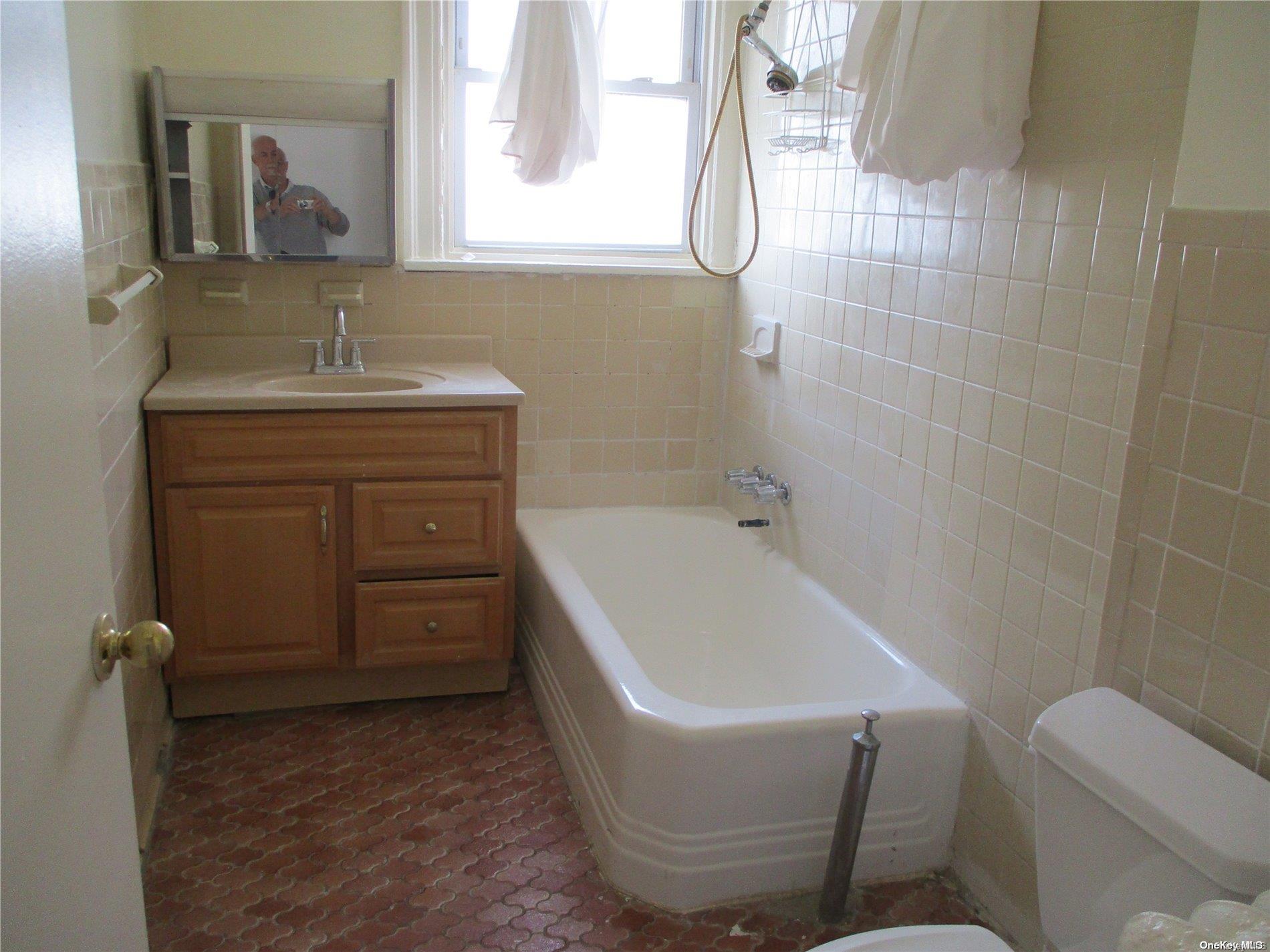 135 Beach 124th Street Queens, NY 11694 - Photo 17 of 25 a bathroom with a sink toilet and shower