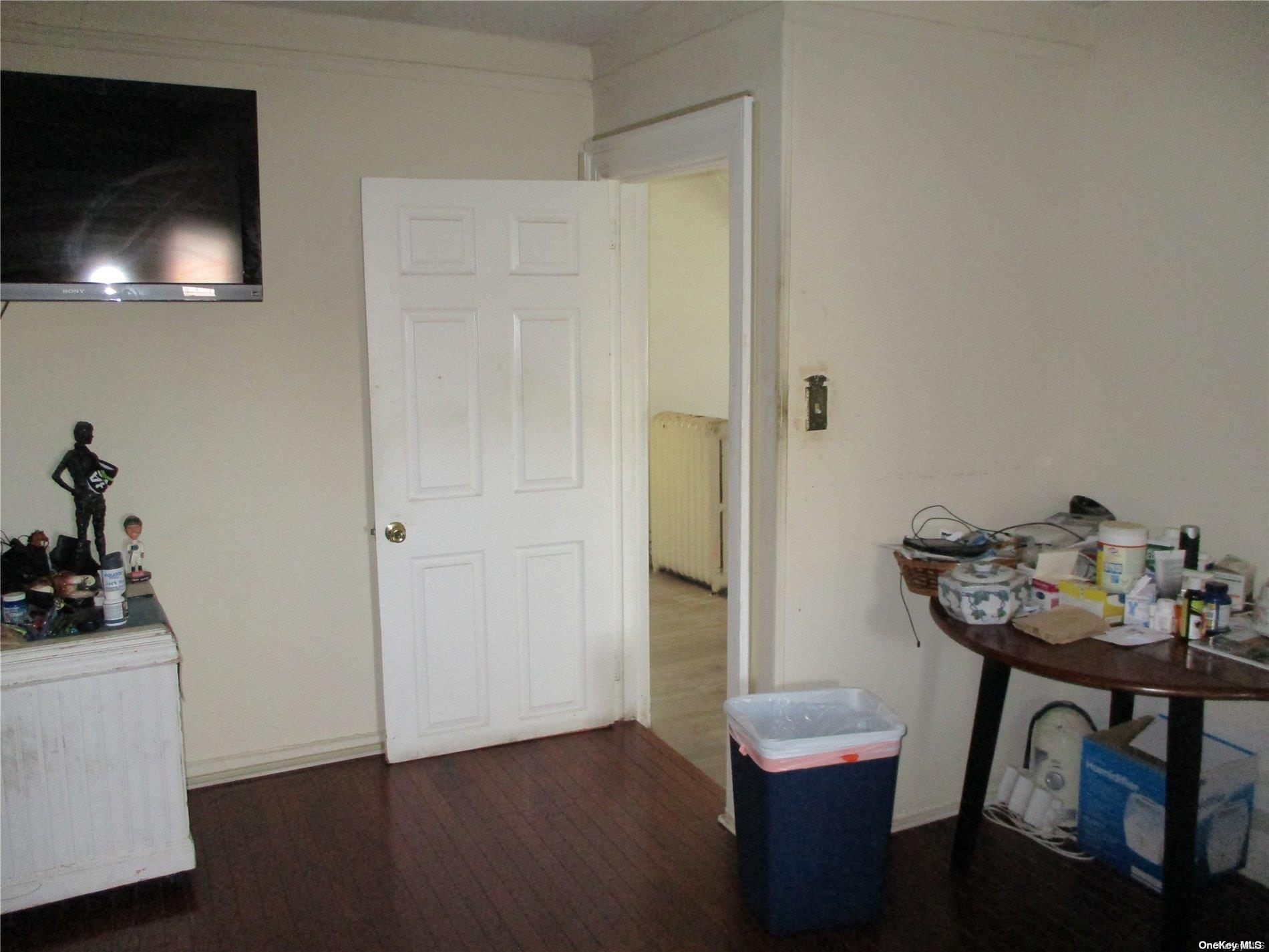 135 Beach 124th Street Queens, NY 11694 - Photo 22 of 25 a view of a room that has a table and chairs in it