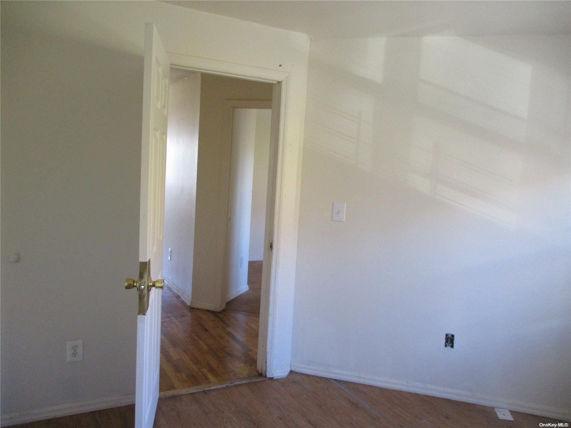 135 Beach 124th Street Queens, NY 11694 - Photo 8 of 25 wooden floor in a gallery