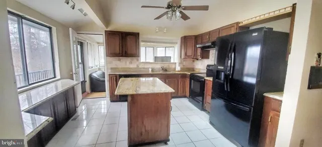 a kitchen with stainless steel appliances a refrigerator and a stove