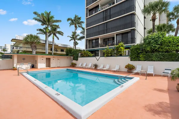 a view of a swimming pool with a patio