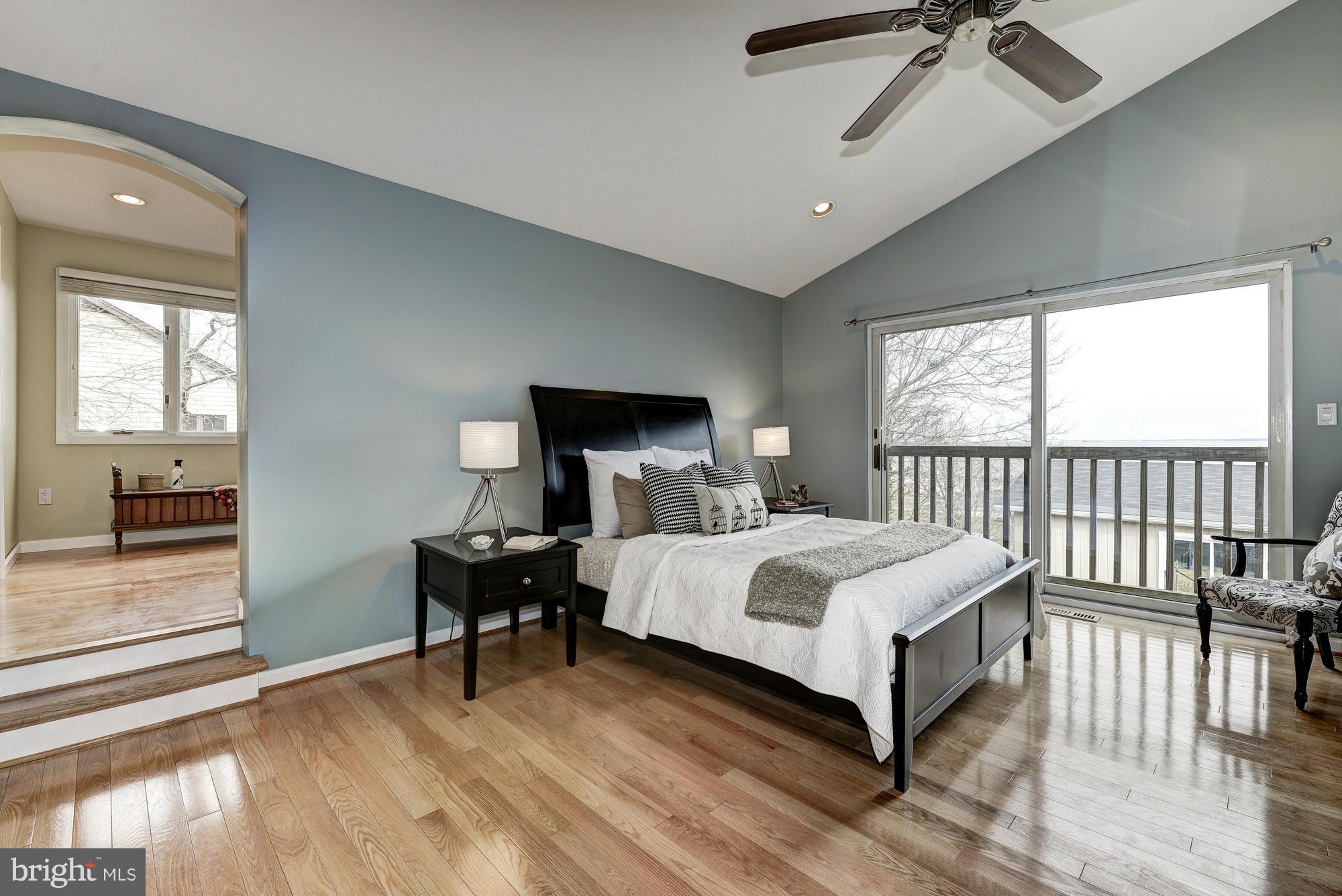 1426 Howard Road Annapolis, MD 21403 - Photo 14 of 30 a bedroom with a bed and wooden floor