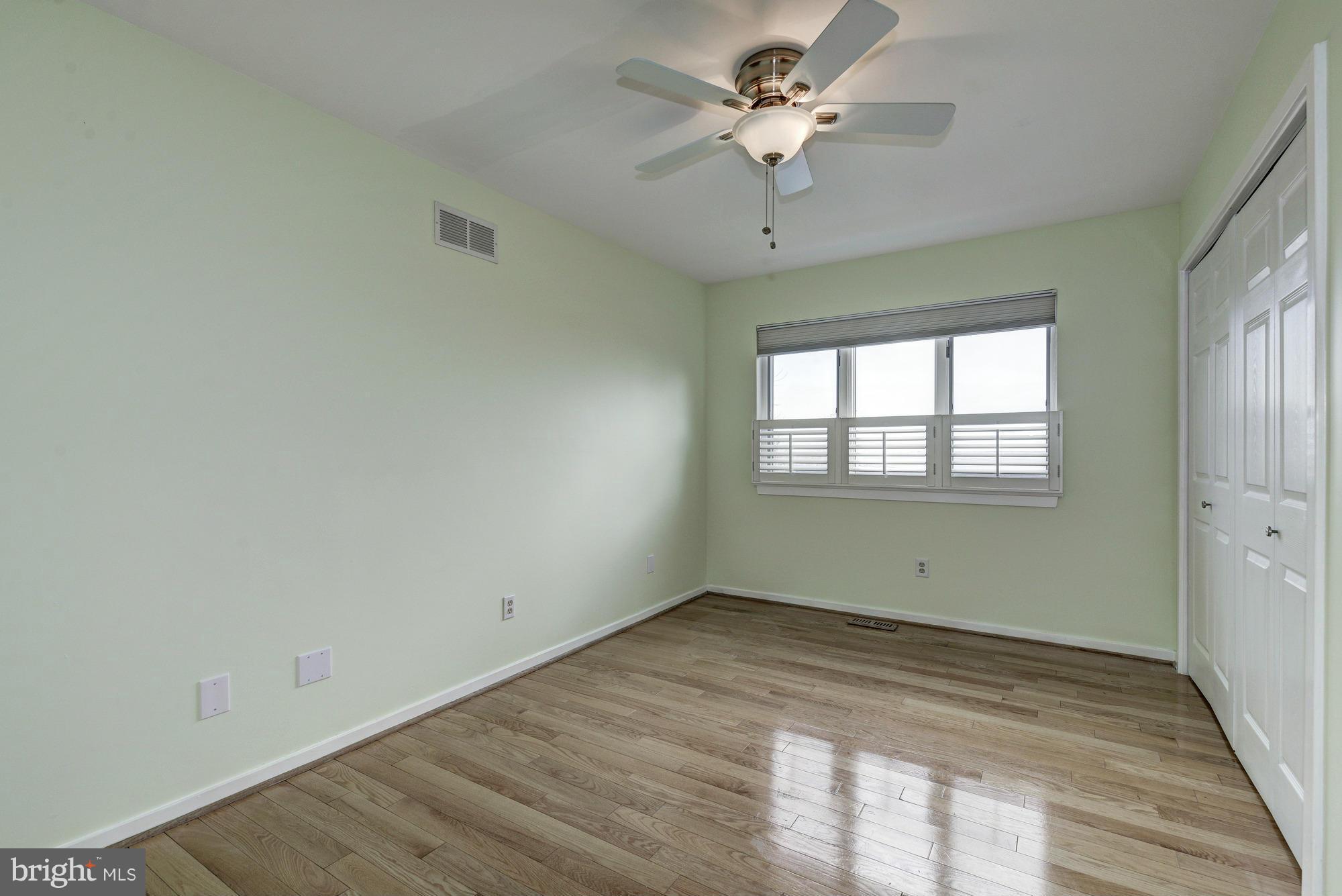 1426 Howard Road Annapolis, MD 21403 - Photo 18 of 30 a view of empty room with wooden floor and fan