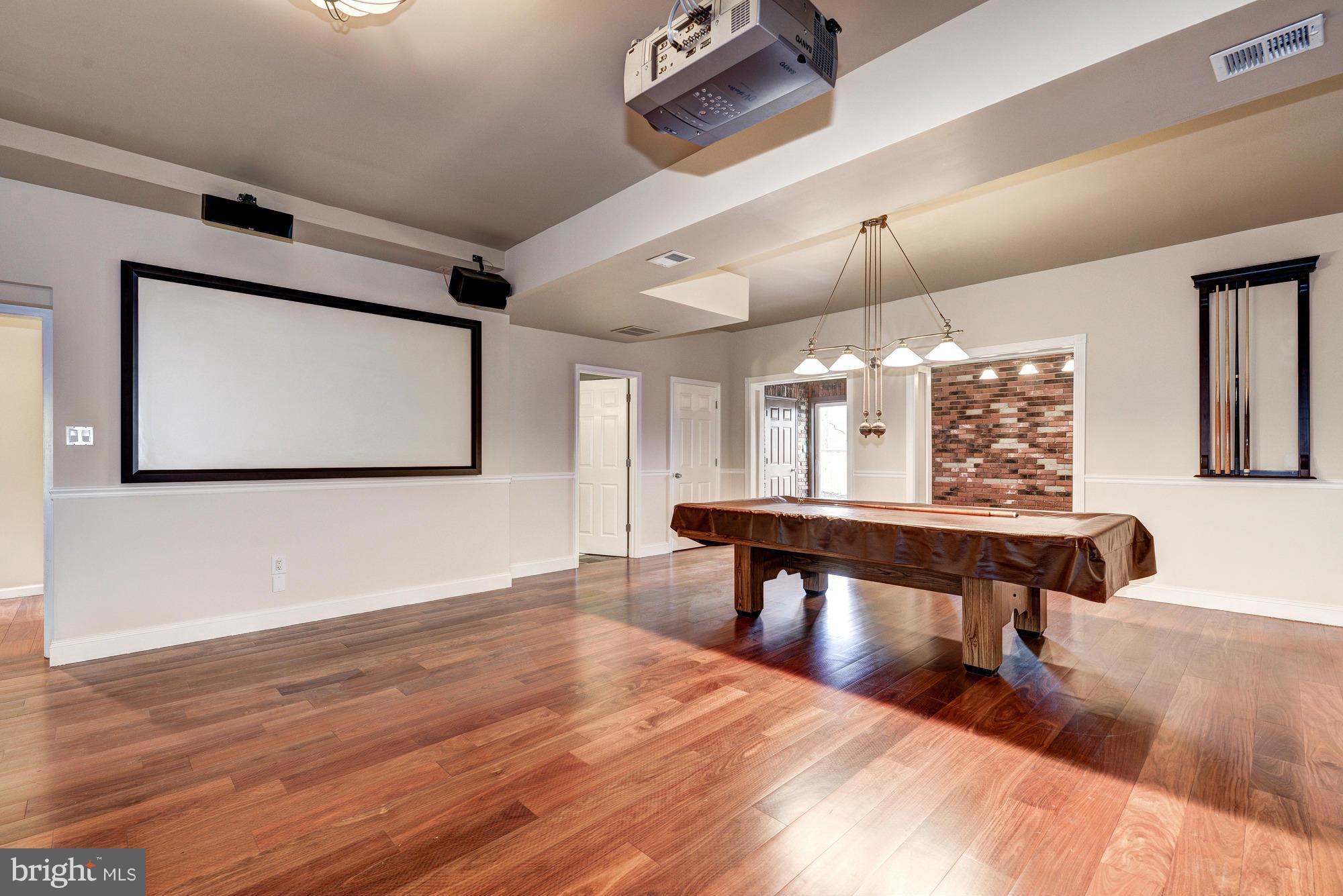 1426 Howard Road Annapolis, MD 21403 - Photo 23 of 30 a room with lots of wooden furniture and a wooden floor