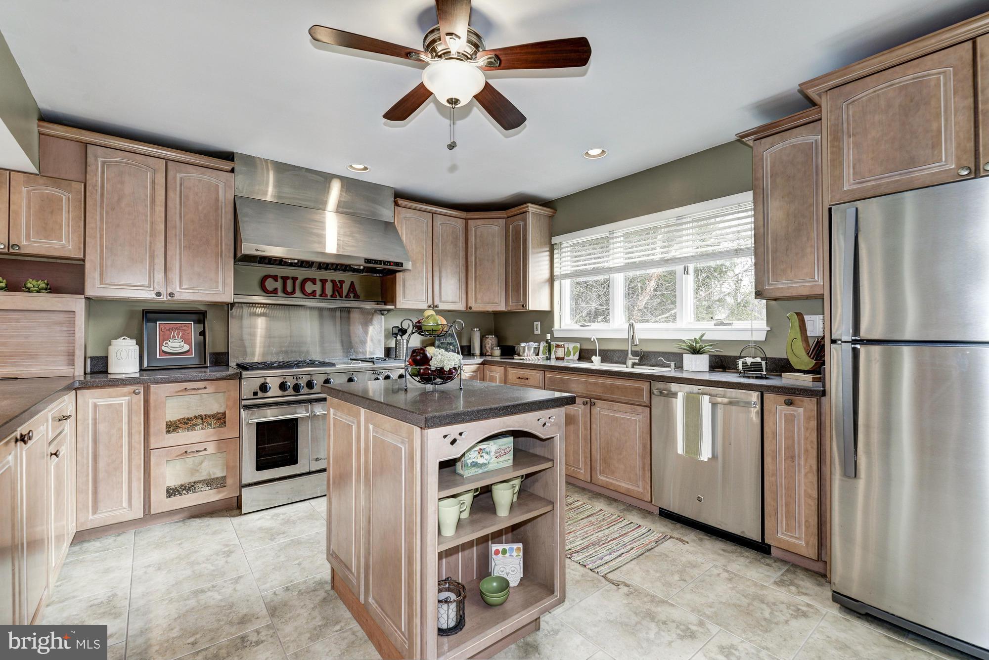 1426 Howard Road Annapolis, MD 21403 - Photo 4 of 30 a kitchen with stainless steel appliances granite countertop a stove a sink dishwasher a refrigerator and a microwave