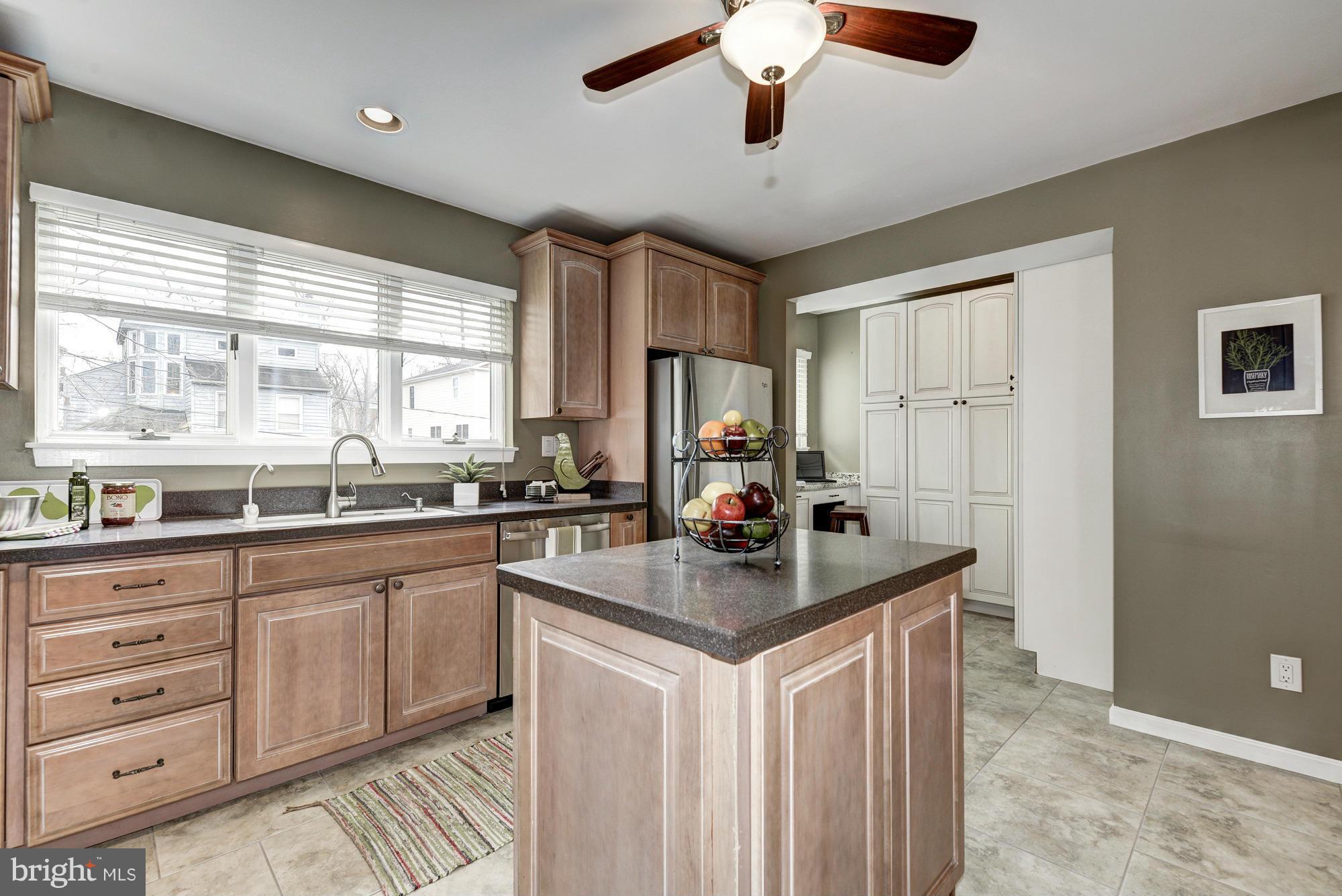 1426 Howard Road Annapolis, MD 21403 - Photo 5 of 30 a kitchen with cabinets appliances a sink and a window