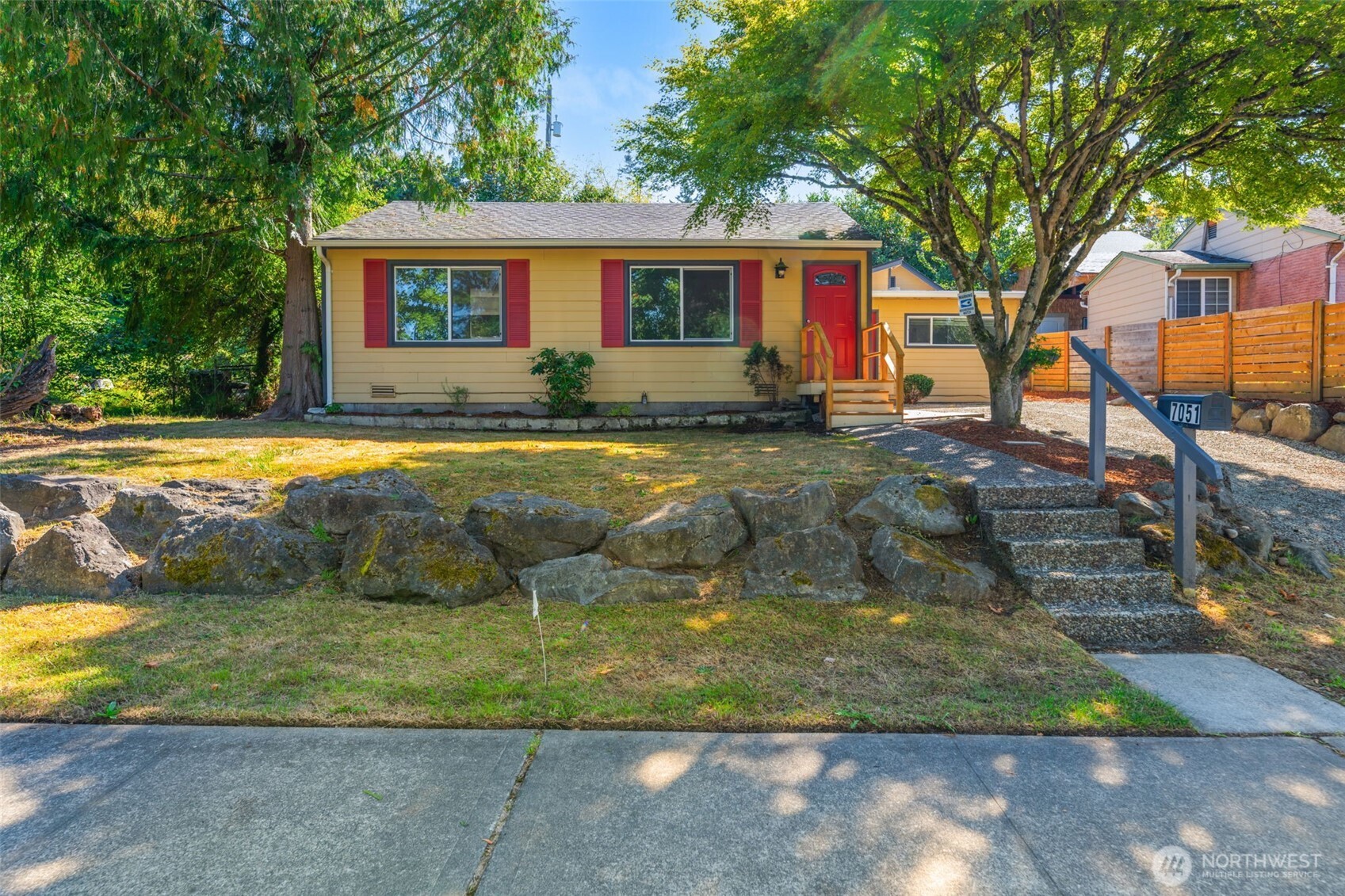 7051 South 125th Street Seattle, WA 98178 - Photo 1 of 1 a view of a house with backyard
