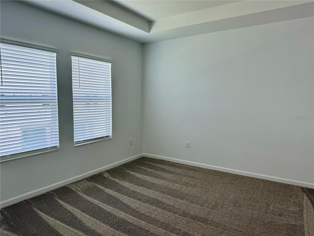 2452 Skyline Loop Kissimmee, FL 34758 - Photo 5 of 12 a room with a window