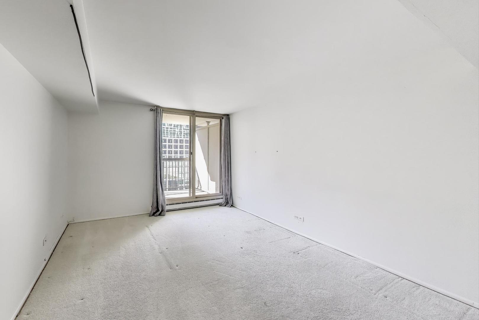 201 East Chestnut Street, Unit 19F Chicago, IL 60611 - Photo 12 of 36 an empty room with windows