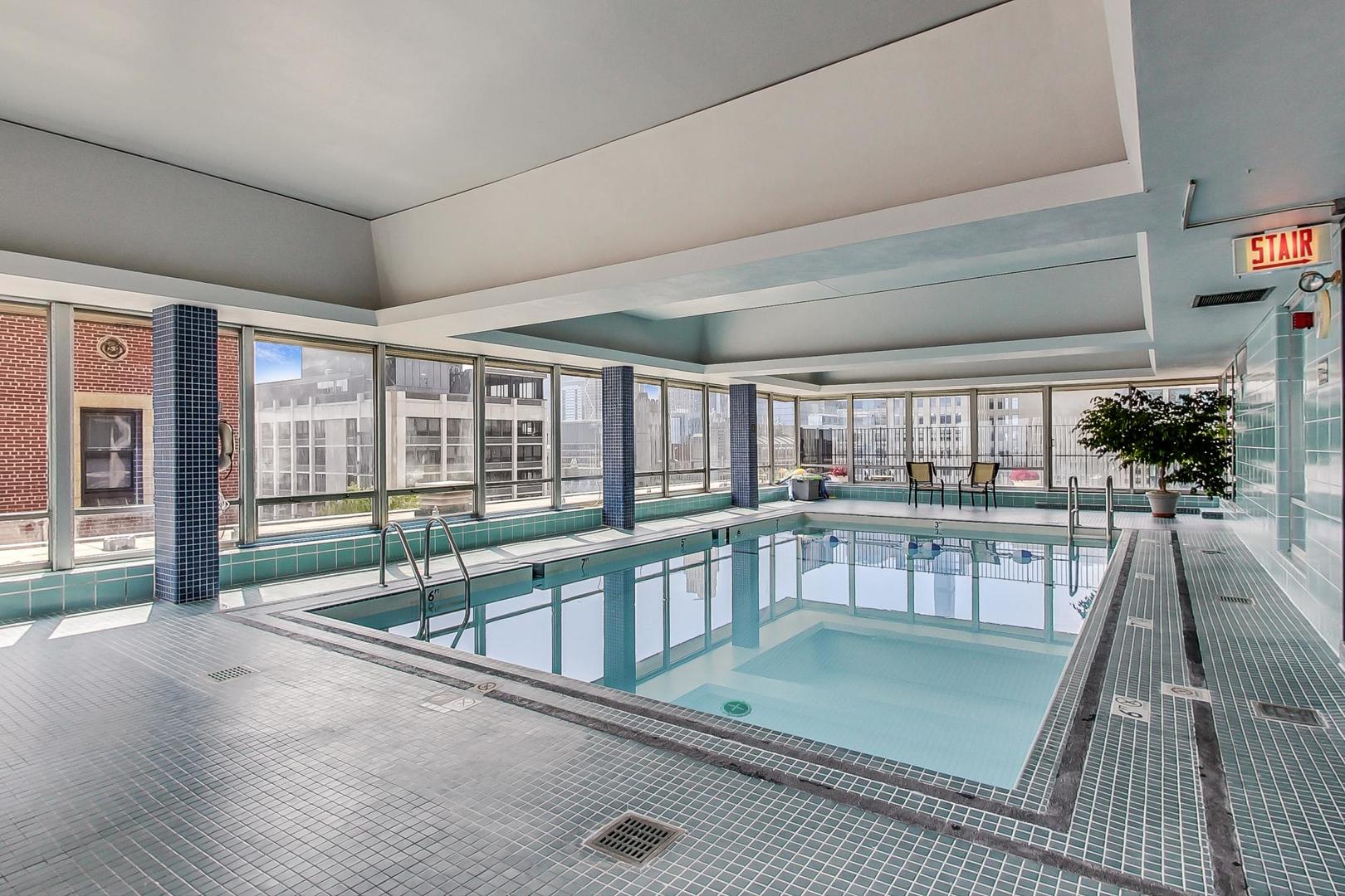 201 East Chestnut Street, Unit 19F Chicago, IL 60611 - Photo 27 of 36 a view of a swimming pool with a balcony