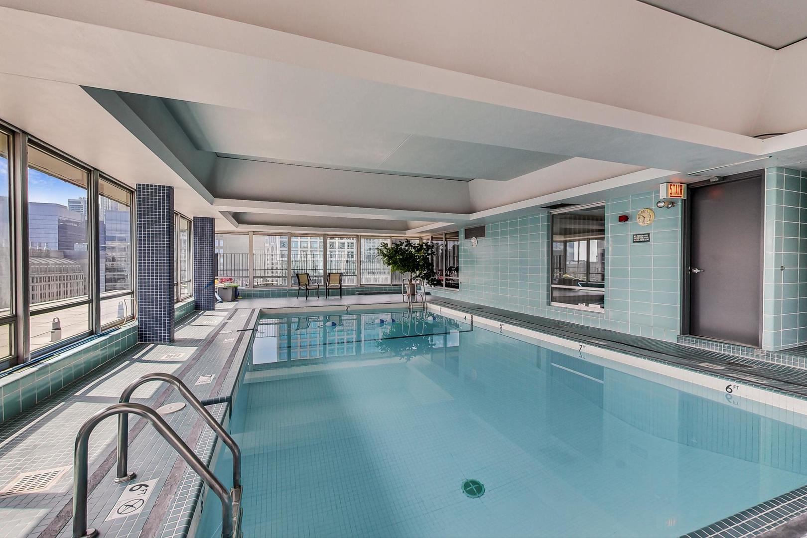 201 East Chestnut Street, Unit 19F Chicago, IL 60611 - Photo 28 of 36 a view of a swimming pool and lounge chair