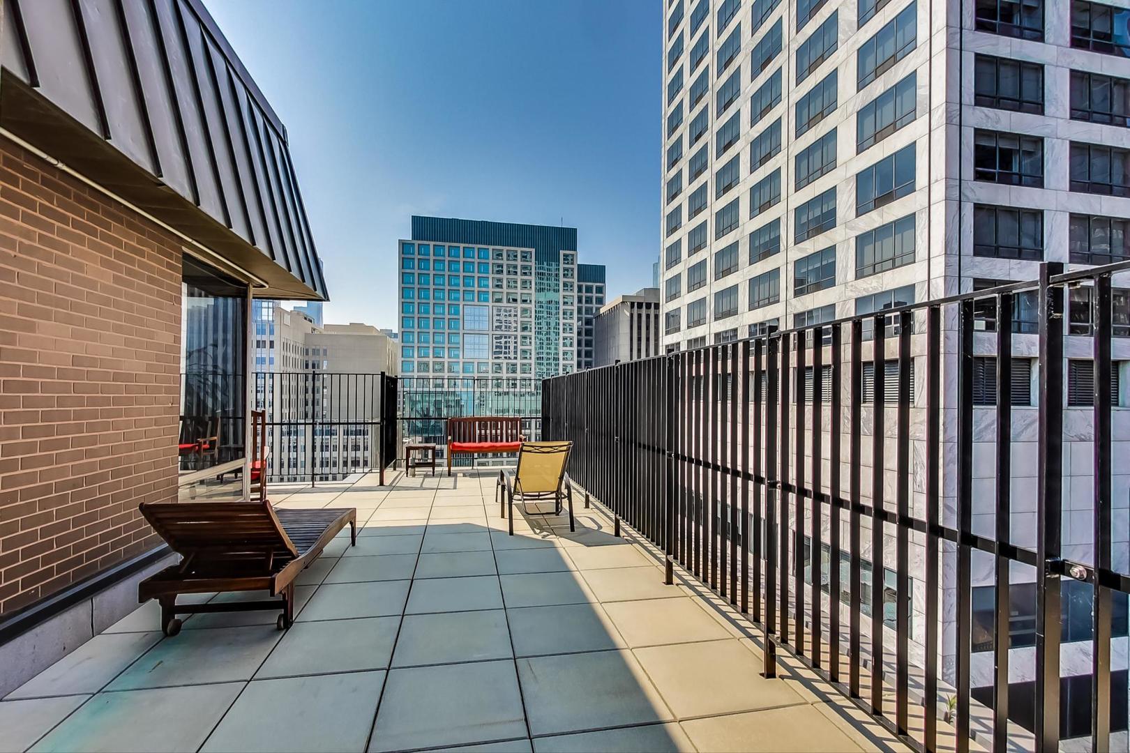 201 East Chestnut Street, Unit 19F Chicago, IL 60611 - Photo 32 of 36 a view of balcony with couch