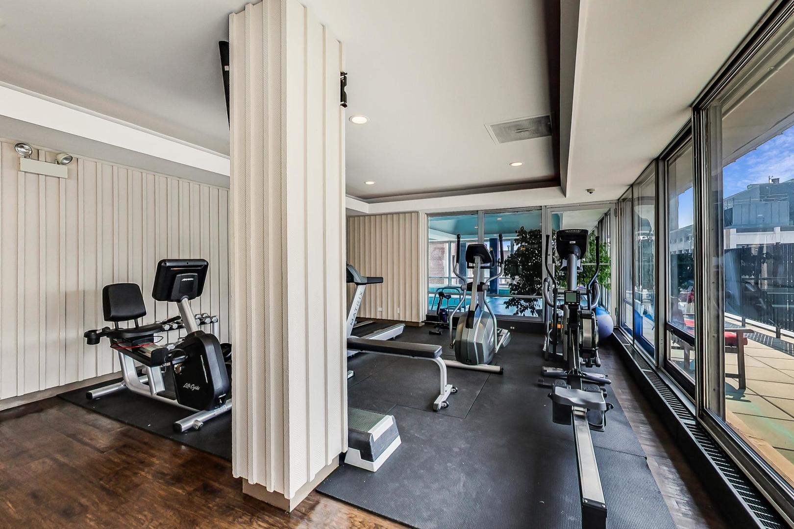 201 East Chestnut Street, Unit 19F Chicago, IL 60611 - Photo 34 of 36 a view of a room with gym equipment