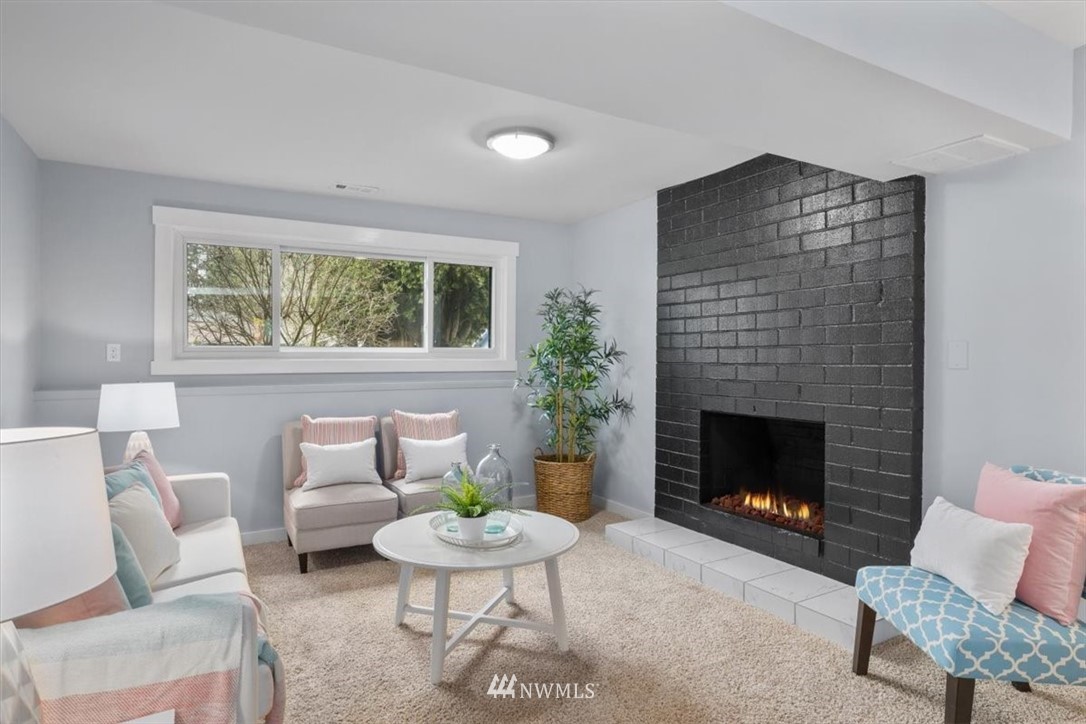 2630 171st Street Southeast Bothell, WA 98012 - Photo 27 of 36 a living room with furniture and a fireplace