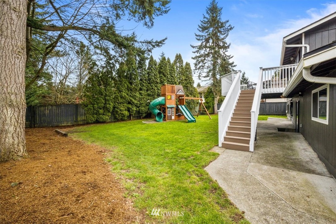 2630 171st Street Southeast Bothell, WA 98012 - Photo 34 of 36 a view of a house with backyard and a tree