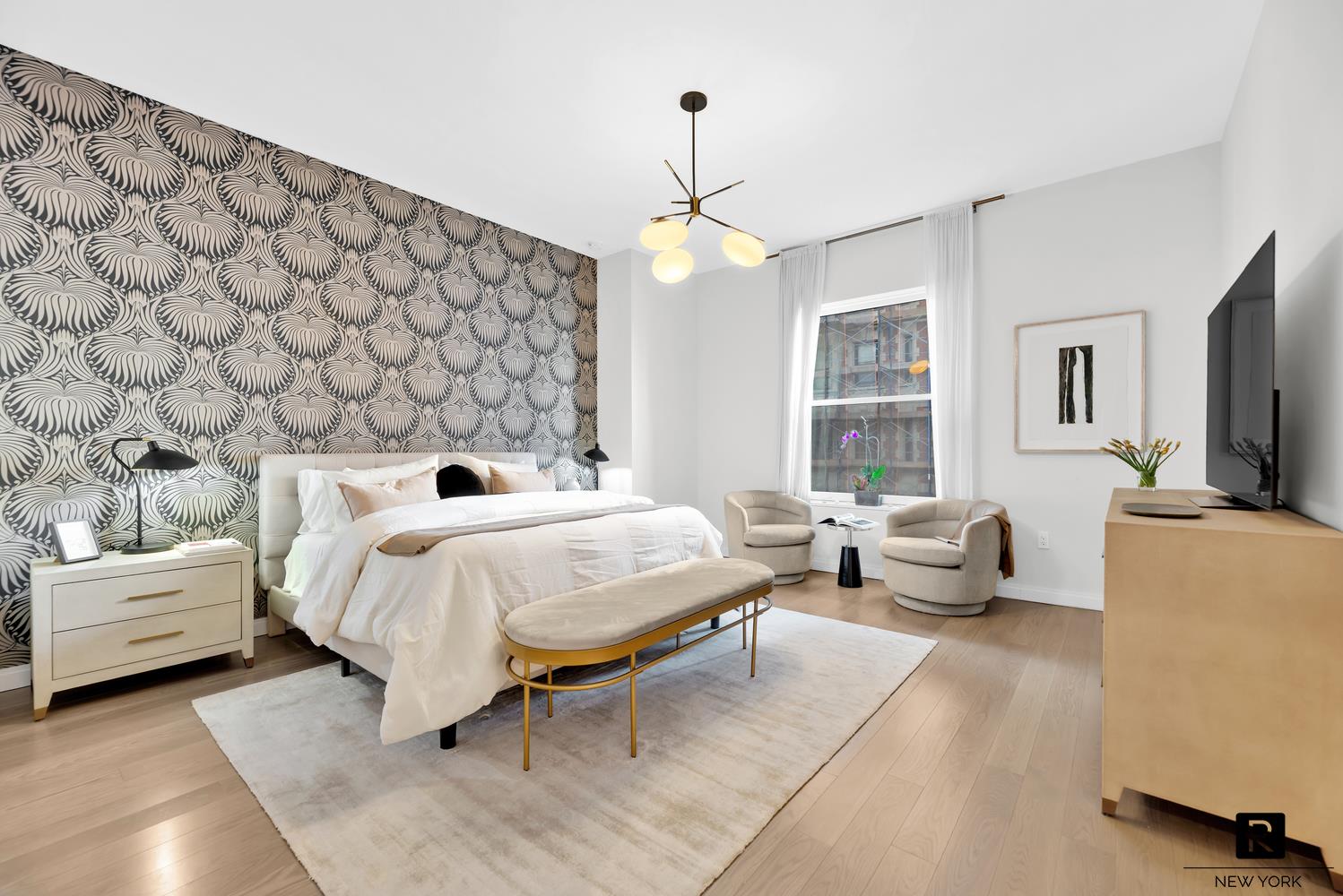 350 West 71st Street, Unit PHA Manhattan, NY 10023 - Photo 10 of 25 a bedroom with a bed and a couch