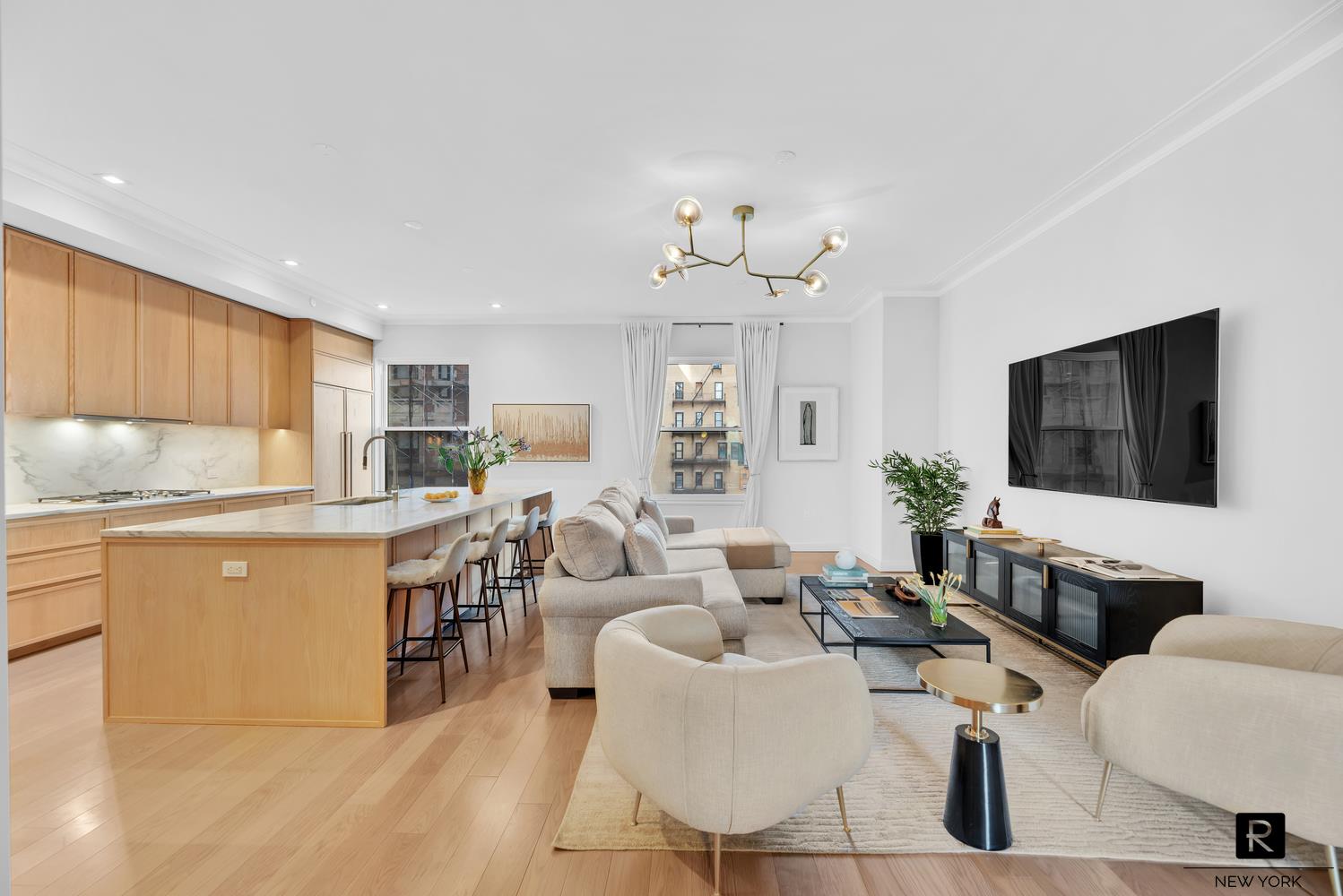 350 West 71st Street, Unit PHA Manhattan, NY 10023 - Photo 8 of 25 a living room with furniture a flat screen tv and kitchen view