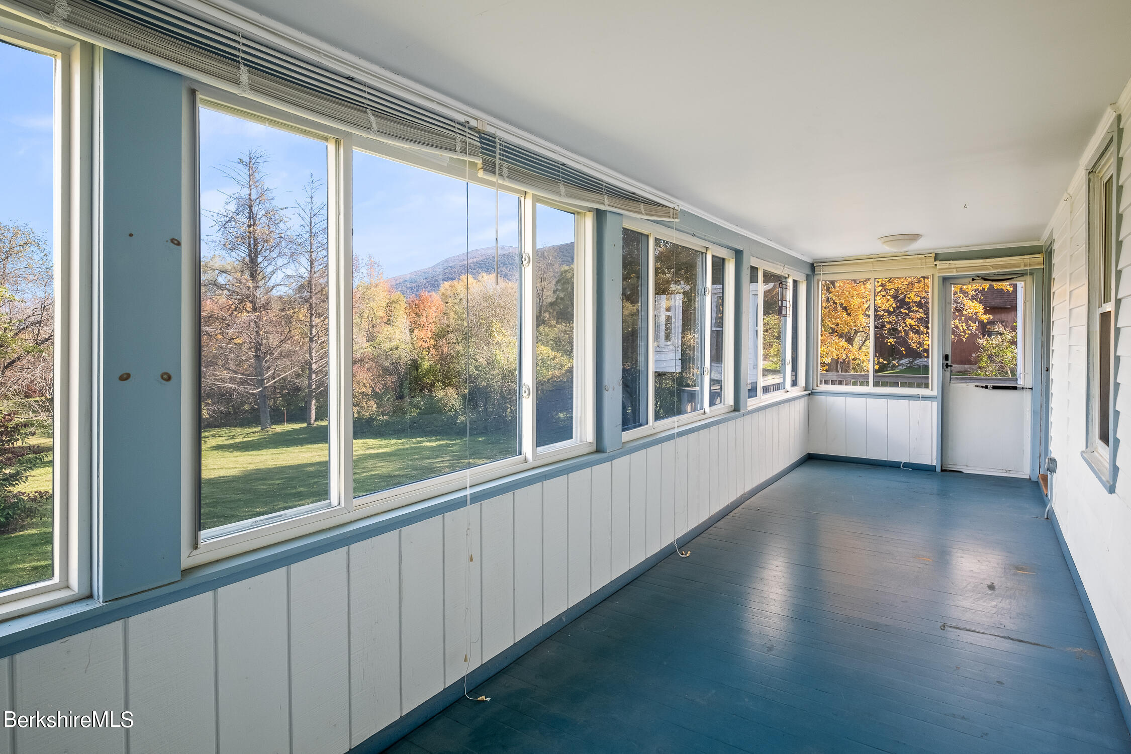 186 Stratton Road Williamstown, MA 01267 - Photo 12 of 33 a view of an empty room with wooden floor and a window