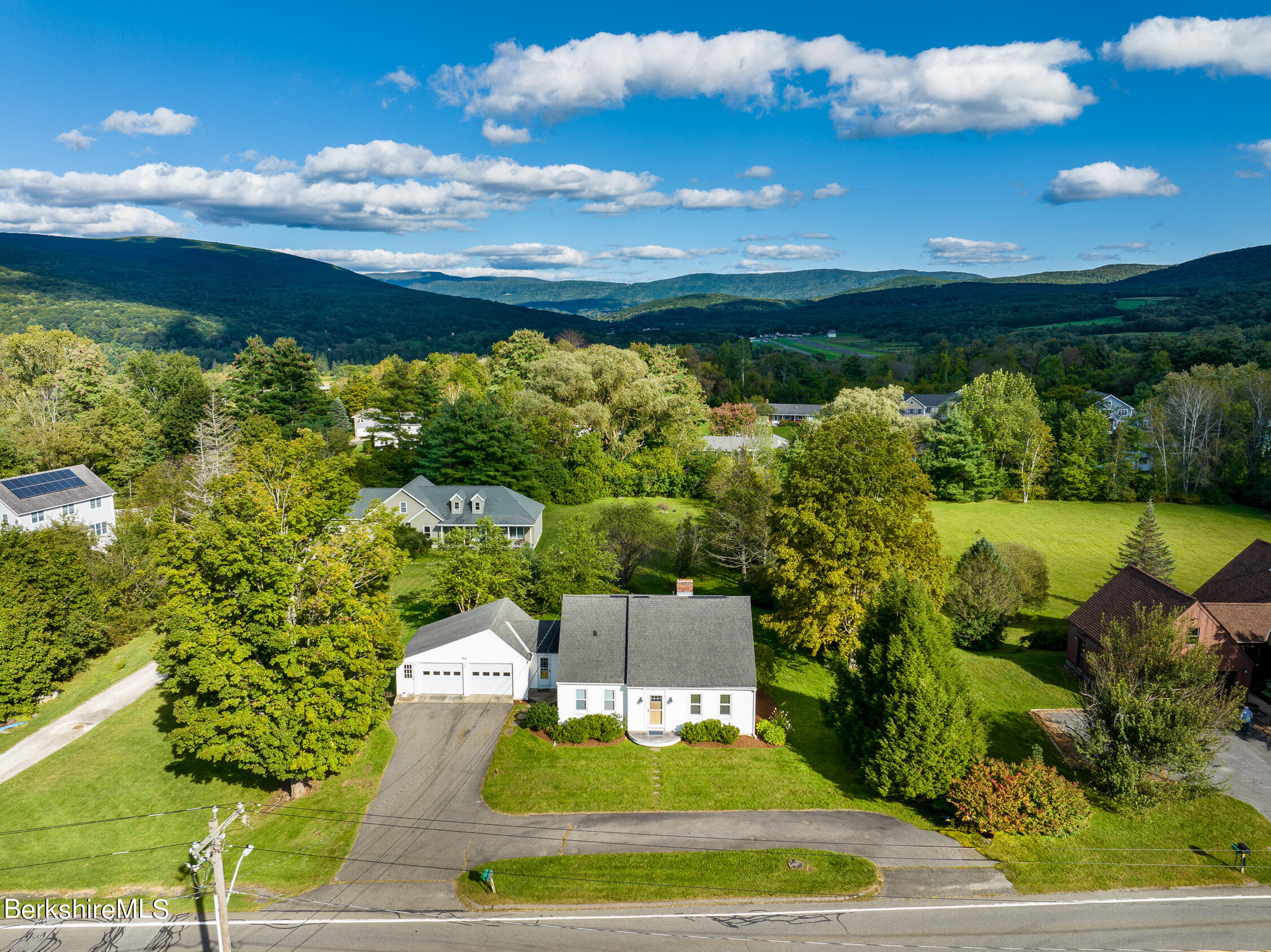 186 Stratton Road Williamstown, MA 01267 - Photo 2 of 33 a view of a swimming pool with an outdoor space and seating area