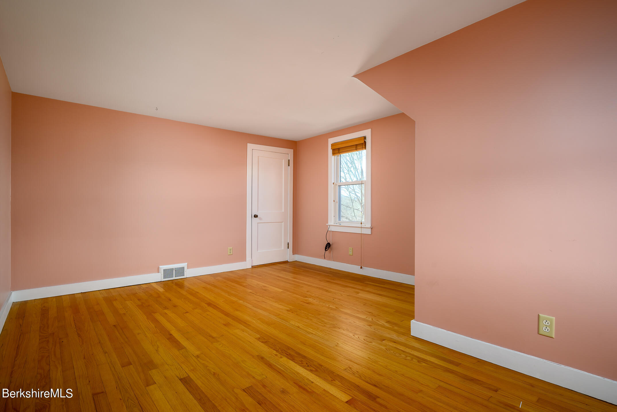 186 Stratton Road Williamstown, MA 01267 - Photo 21 of 33 a view of an empty room with wooden floor and a window