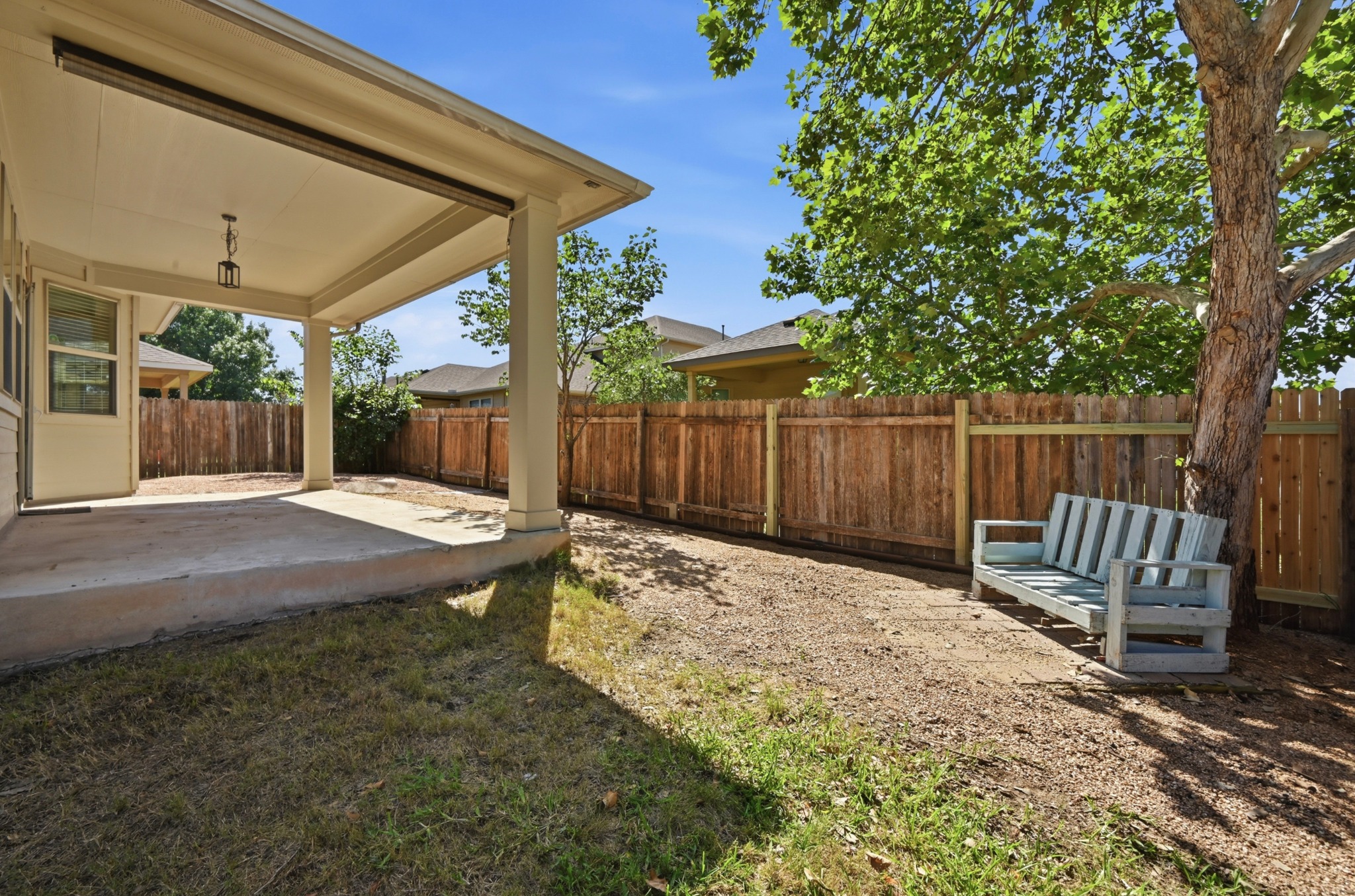 351 Wincliff Drive Buda, TX 78610 - Photo 35 of 40 A spacious covered patio provides a delightful outdoor living area, complemented by a private fenced yard.