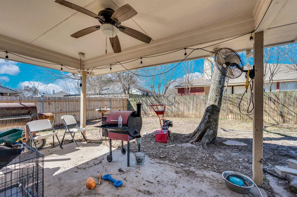 1003 Short Line Boulevard Midlothian, TX 76065 - Photo 12 of 25 Fenced backyard with a patio area, a grill, and ceiling fan