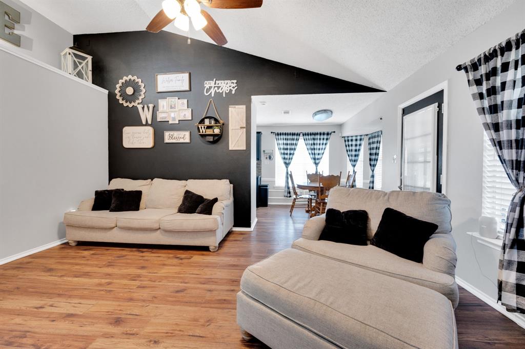 1003 Short Line Boulevard Midlothian, TX 76065 - Photo 15 of 25 Living area with wood finished floors, lofted ceiling, and a ceiling fan